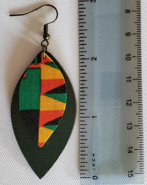 Almond shaped drop earring is green in color. African inspired print cloth is attached at the top. The earring is about 2 inches in height and about 1 inch at the widest part of the earring.