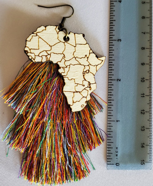 Africa Charm attached to tassel earring. Tassel is rainbow in color. Size is 4 inches height x 1 1/2 inches across 